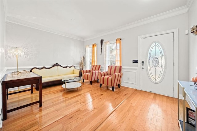 entryway with crown molding and hardwood / wood-style floors