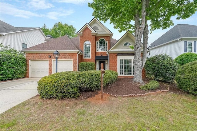 1996 Wellesley Trce, Atlanta, GA 30338 - traditional-style house with brick siding, a garage, concrete driveway, and a front lawn