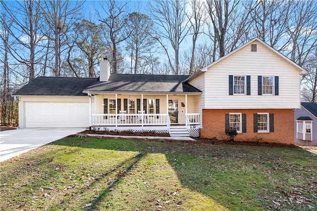 view of front of property with covered porch, a garage, and a front lawn