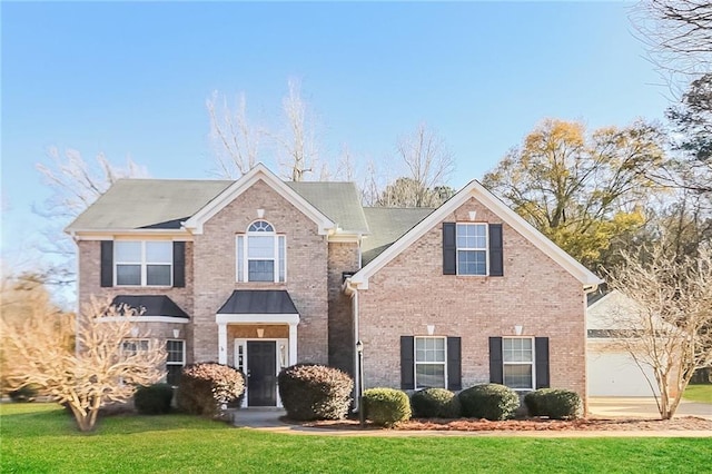 122 Melrose Creek Dr, Stockbridge, GA 30281 - traditional-style home featuring brick siding, a front yard, and an attached garage