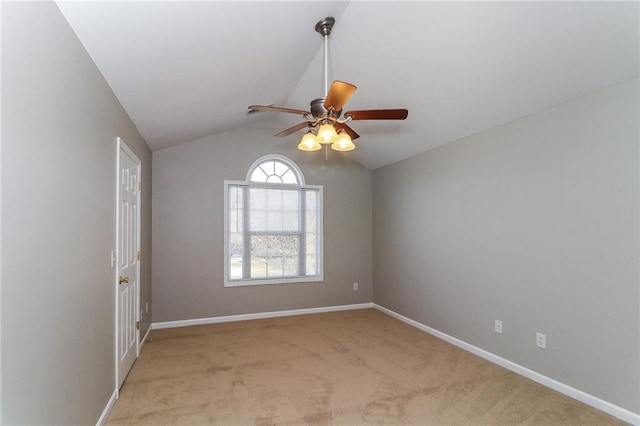 122 Melrose Creek Dr, Stockbridge, GA 30281 - spare room with a ceiling fan, light colored carpet, vaulted ceiling, and baseboards