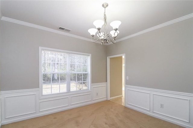 122 Melrose Creek Dr, Stockbridge, GA 30281 - spare room with a chandelier, crown molding, a wainscoted wall, light colored carpet, and a decorative wall