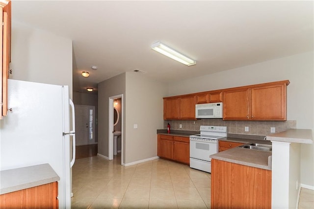 122 Melrose Creek Dr, Stockbridge, GA 30281 - kitchen with white appliances, backsplash, brown cabinets, and baseboards
