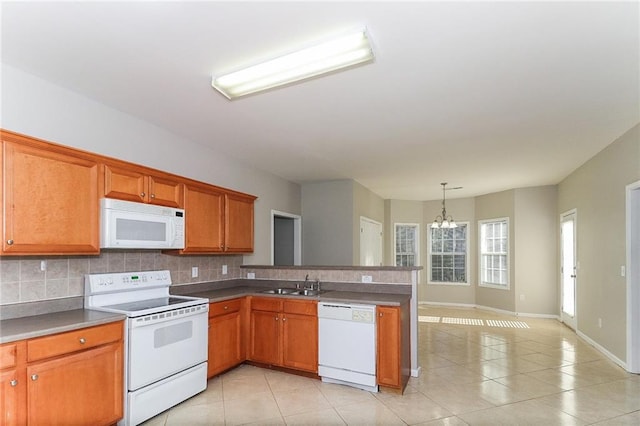 122 Melrose Creek Dr, Stockbridge, GA 30281 - kitchen featuring white appliances, a sink, a chandelier, and backsplash