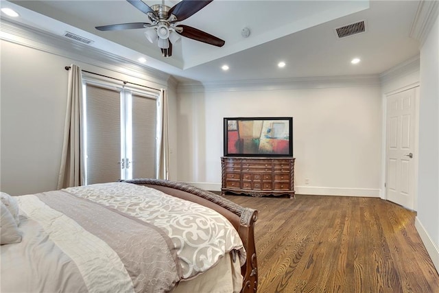 bedroom featuring ceiling fan, hardwood / wood-style flooring, and ornamental molding