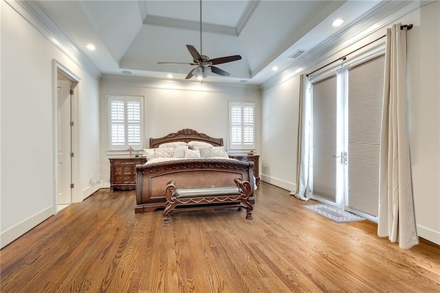 bedroom featuring ornamental molding, hardwood / wood-style flooring, vaulted ceiling, and ceiling fan