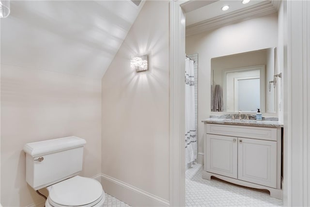 bathroom with vanity, toilet, lofted ceiling, and a shower with curtain