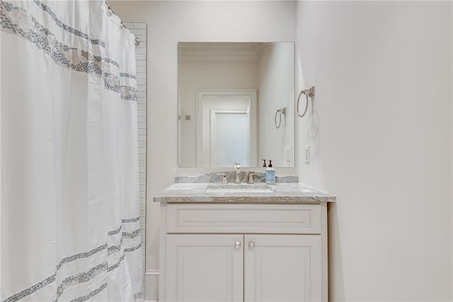 bathroom with vanity, crown molding, and a shower with shower curtain