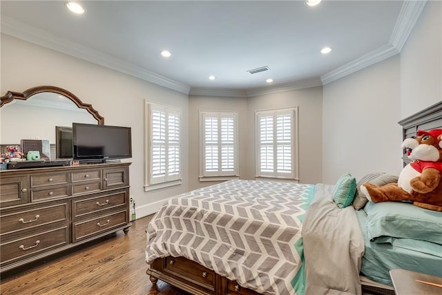 bedroom featuring light hardwood / wood-style floors and ornamental molding