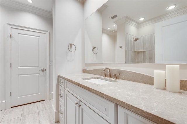 bathroom with vanity, crown molding, tile patterned floors, and walk in shower