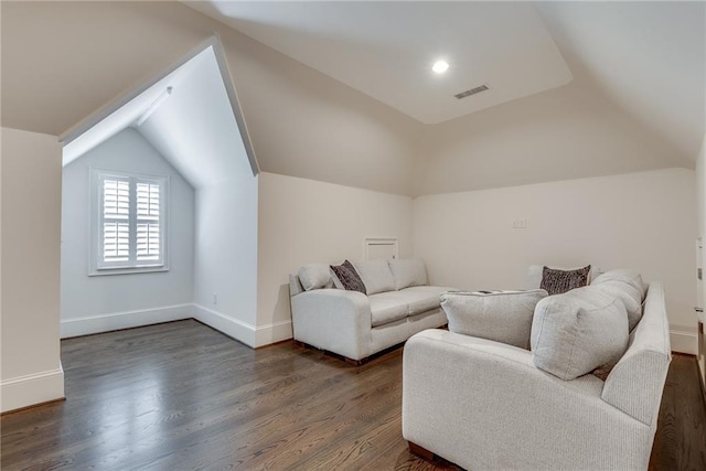 living room featuring lofted ceiling and dark hardwood / wood-style flooring