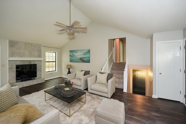 living room with ceiling fan, dark hardwood / wood-style flooring, and lofted ceiling