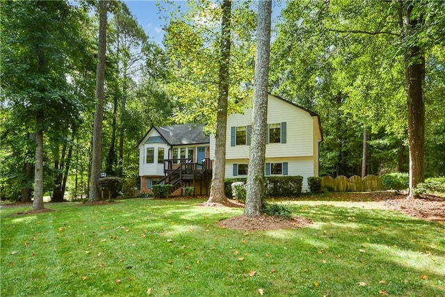 rear view of house with a yard