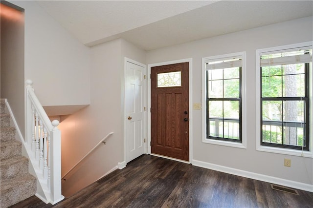 entryway with dark wood-type flooring