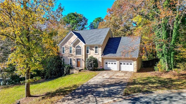 view of front facade with a garage and a front yard