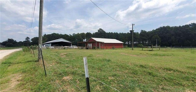 2268 Horse Farm Rd, Dewy Rose, GA 30634 - view of yard with a rural view, fence, and an outdoor structure