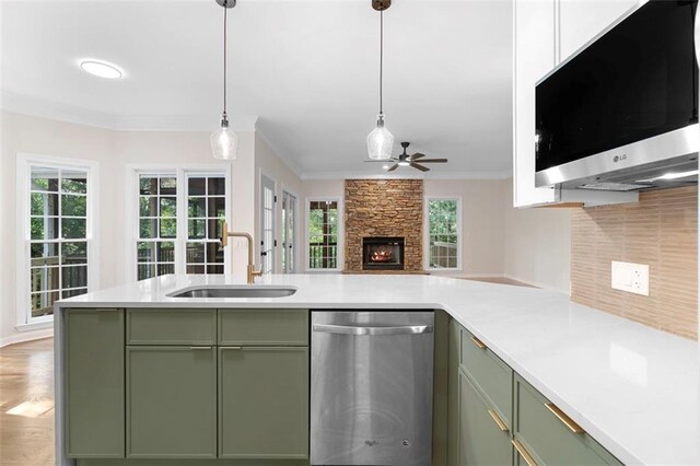 184 Corner Oak Ct, Waleska, GA 30183 - kitchen with stainless steel range with gas cooktop, ornamental molding, green cabinets, tasteful backsplash, and a peninsula