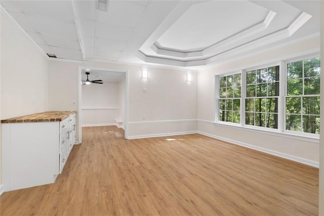 184 Corner Oak Ct, Waleska, GA 30183 - unfurnished room with crown molding, light wood-style flooring, ceiling fan, and a tray ceiling