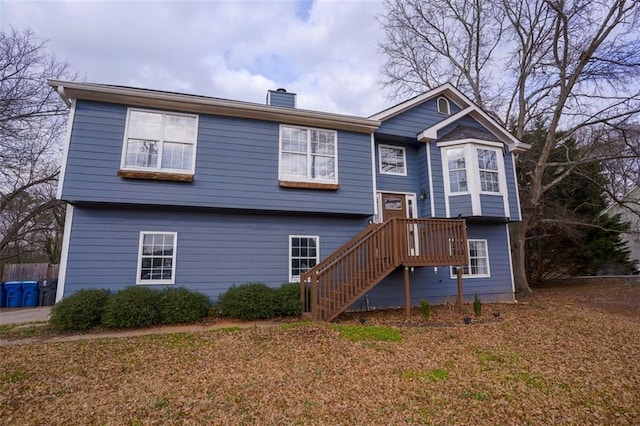 view of front of house featuring a chimney