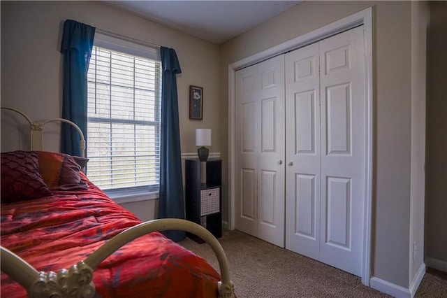 carpeted bedroom featuring a closet