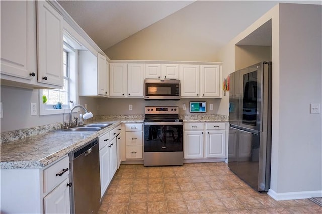 kitchen with white cabinets, stainless steel appliances, and a sink