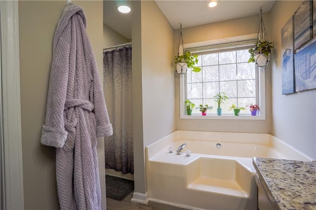 bathroom featuring a bath