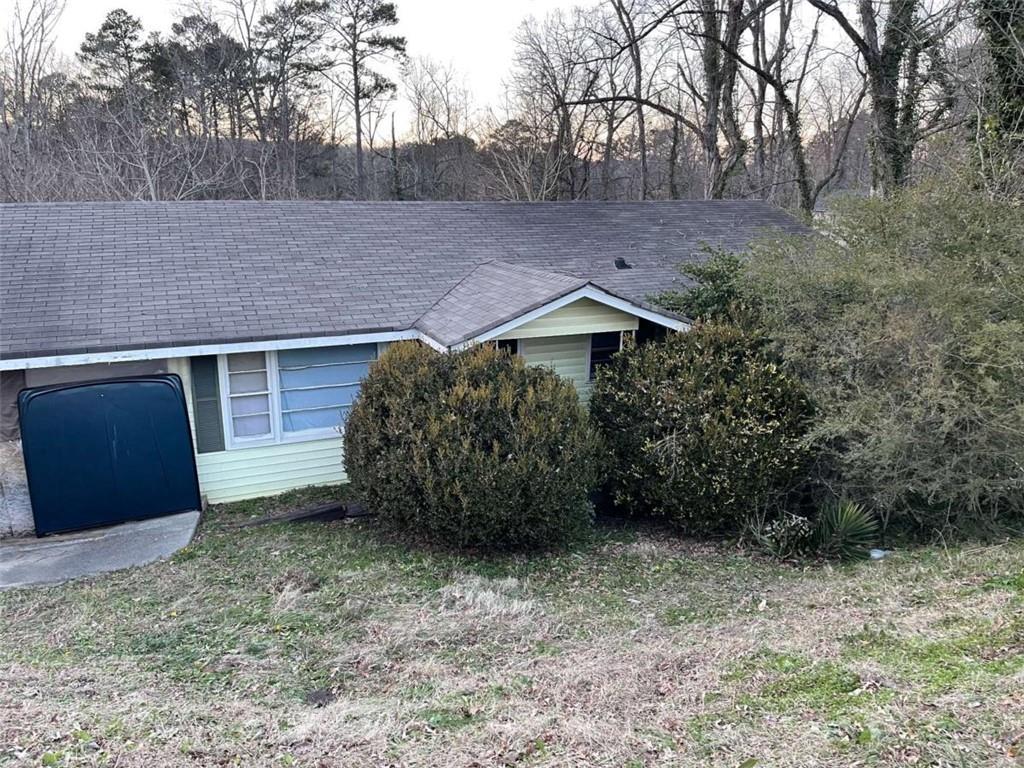 view of property exterior with a lawn