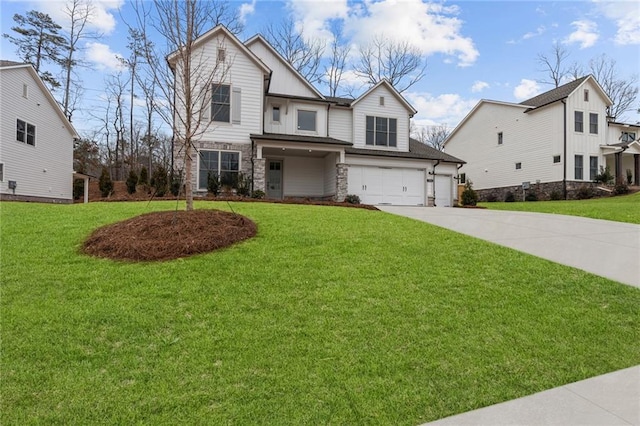 view of front of home featuring a garage and a front lawn