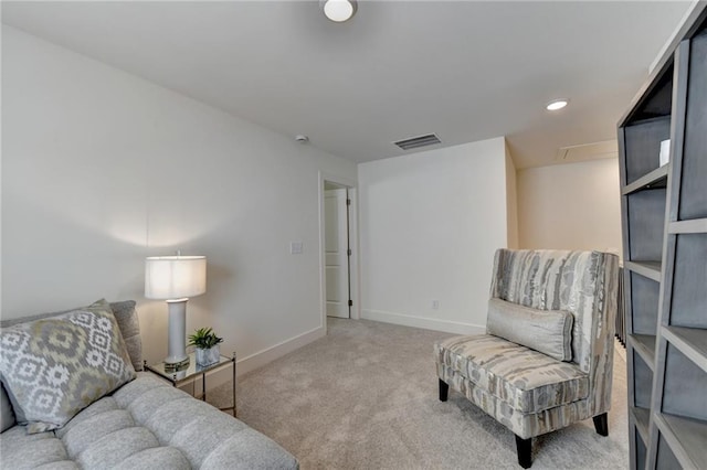 sitting room with carpet floors