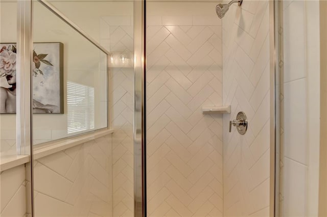 bathroom with a tile shower