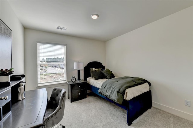 bedroom with light colored carpet