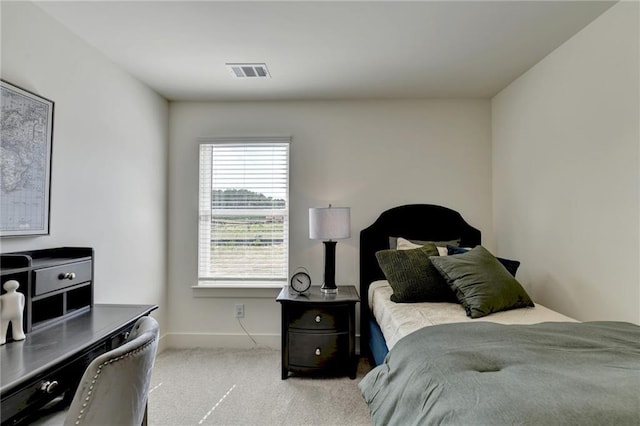 carpeted bedroom featuring multiple windows