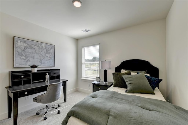 bedroom featuring light carpet