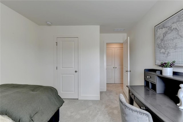 bedroom featuring light colored carpet