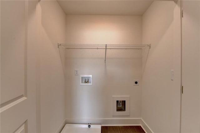 clothes washing area with electric dryer hookup, hardwood / wood-style floors, and washer hookup