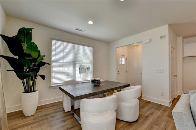 dining area featuring light wood-type flooring