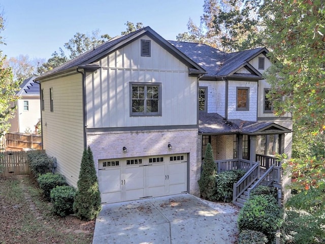 view of front of home featuring a porch and a garage