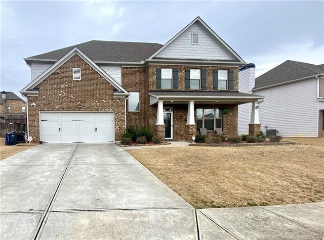 view of front of property with central air condition unit, covered porch, brick siding, a shingled roof, and concrete driveway