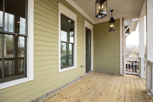 wooden terrace featuring covered porch