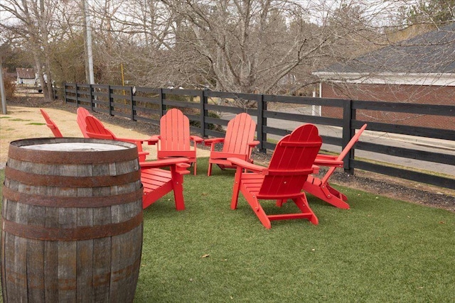 exterior space with fence and a fire pit