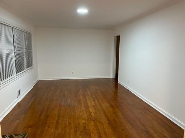 2225 Harold Ln SE, Smyrna, GA 30080 - unfurnished room with dark wood finished floors and baseboards