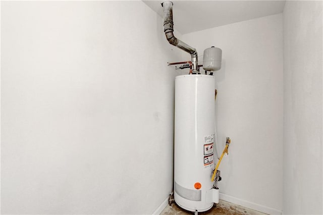 utility room featuring water heater