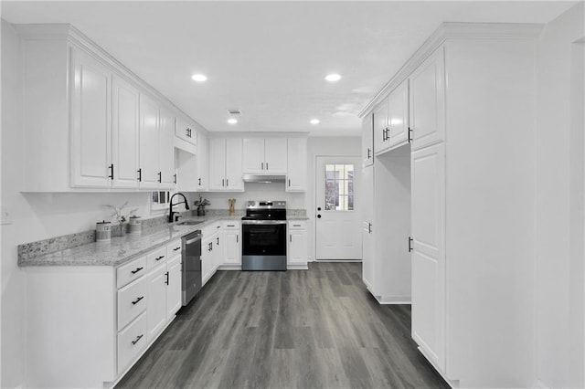 kitchen featuring under cabinet range hood, dark wood finished floors, white cabinets, stainless steel appliances, and a sink