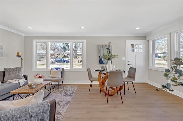 interior space with crown molding and light hardwood / wood-style floors