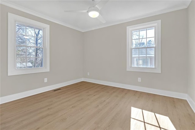 unfurnished room with ceiling fan, crown molding, and light hardwood / wood-style flooring