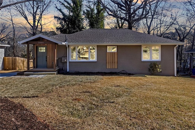 ranch-style house with central AC and a front yard