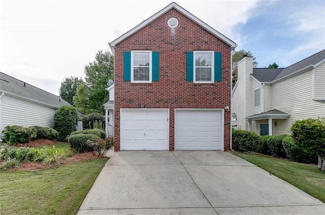 view of property with a garage and a front yard