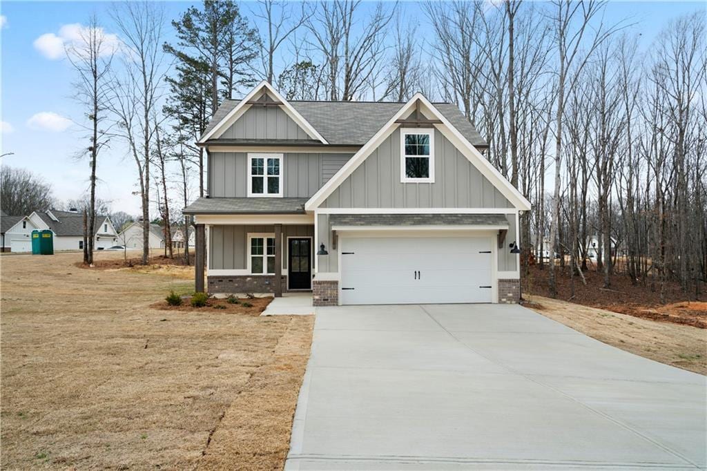 craftsman-style house with covered porch and a garage