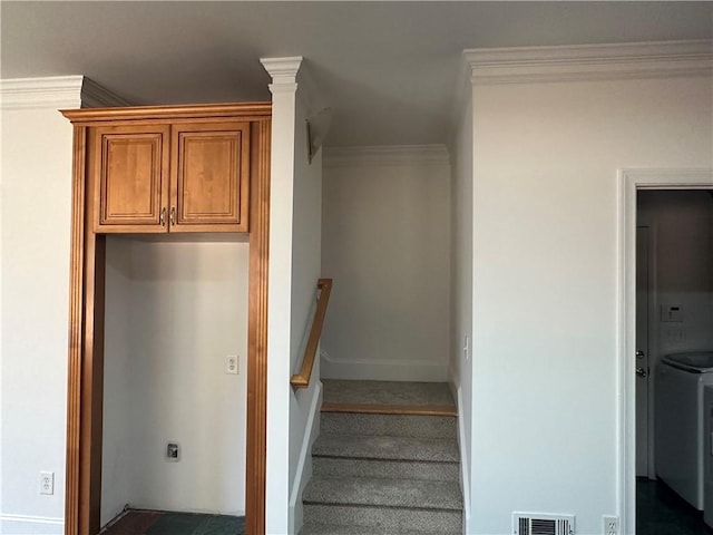 staircase featuring crown molding, baseboards, and visible vents