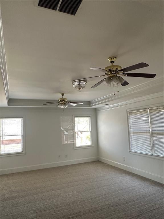 unfurnished room featuring crown molding, ceiling fan, and light colored carpet
